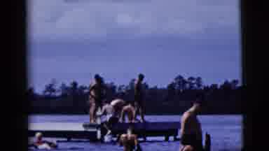 New York City (1958): A Lot Of Men Swimming On The Lake