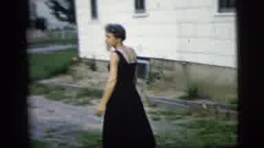 New York City (1958): Middle-Aged Woman In Black Dress Walks Away From Camera Then