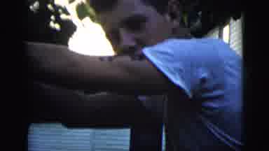 New York City (1958): Two Young Men Swinging On A Tree Outside Of A House
