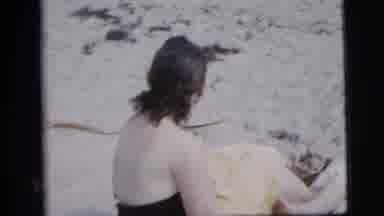 New York City (1958): Three Dark-Haired Women Sitting On Sandy Beach Eating