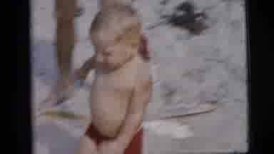 New York City (1958): A Happy Young Boy Playing With His Family Near The Beach And