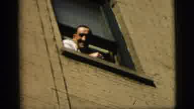 New York City (1958): A Man In Window Talking To Women Outside