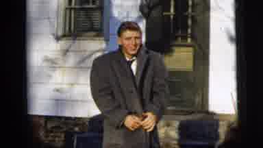New York City (1958): Young Man Wearing A Coat Over A Suit
