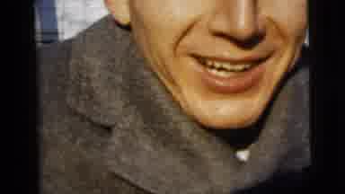 New York City (1958): Man Kissing Camera Wearing Overcoat And Smiling