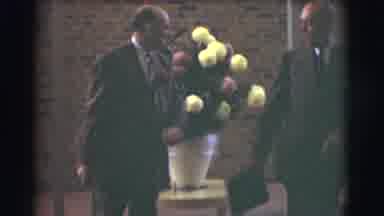 Saint Louis Missouri (1959): Two Men Who Are In A Room With Flowers And Brick