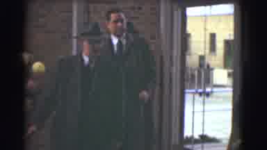 Saint Louis Missouri (1959): A Group Of Men In Trench Coats Walking Into A Funeral