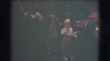 Saint Louis Missouri (1959): Man Adjusts Tan Pants Of Infant While People Talk At