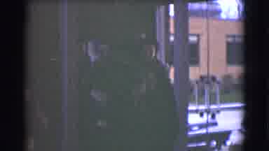 Saint Louis Missouri (1959): Woman Wearing Black Hat Carries Child Wearing Blue