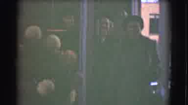 Saint Louis Missouri (1959): People Wearing Winter Coats Walk Into A Building That