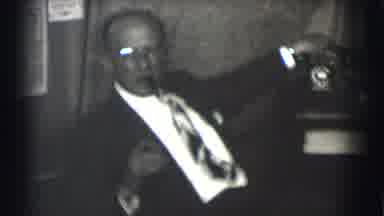 Saint Louis Missouri (1959): A Seated Man Dressed In A Suit And Tie And Smoking A