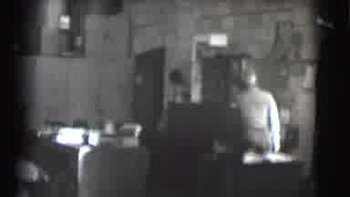 Saint Louis Missouri (1959): A Man At A Desk Looks At Something On The Wall