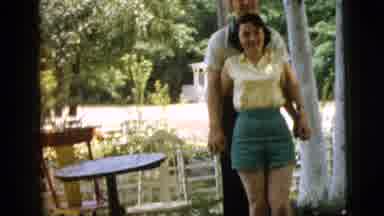 Camden New Jersey (1961): Man Stands Behind Woman And Picks Up Her Arms And Makes