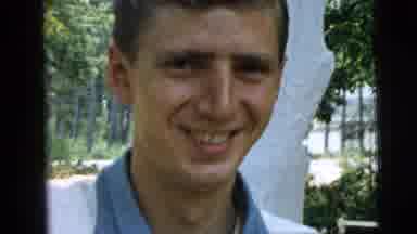 Camden New Jersey (1961): A Young Man Standing Outside Saying Something Happy