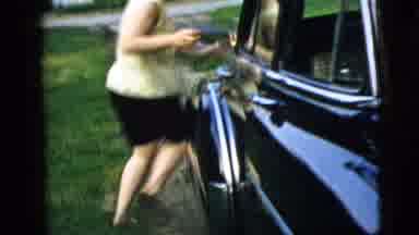 Camden New Jersey (1961): People Sitting And A Woman Running Around A House And A
