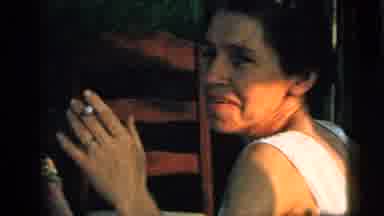 Camden New Jersey (1961): Brown-Haired Woman And Yellow Blouse Sitting Smoking And