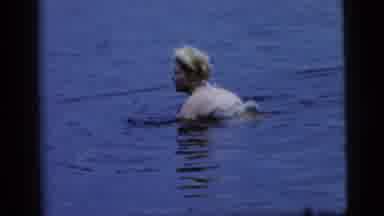 Camden New Jersey (1961): Woman Wearing A Bathing Suit In The Water Slightly