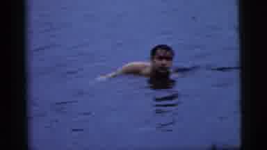 Camden New Jersey (1961): Half Naked Man Swimming In A Lake Towards An Approaching