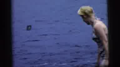Camden New Jersey (1961): Young Lady And Man Swimming In A Lake And Getting Into