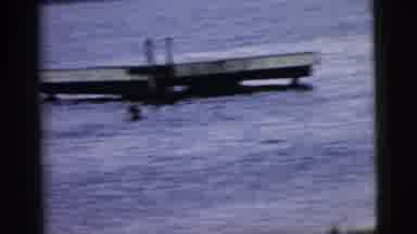 Camden New Jersey (1961): People Swim In Blue Water Next To Wooden Platform With