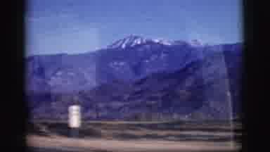 Clarkdale Arizona (1961): High Mountains On A Sunny Day Being Seen Through A Car