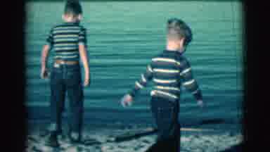 Clarkdale Arizona (1961): Two Boys In Striped Shirts And Jeans Walking At The Edge