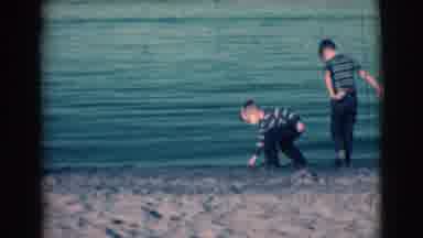 Clarkdale Arizona (1961): Two Young Boys Picking Up Rocks Standing Next To The