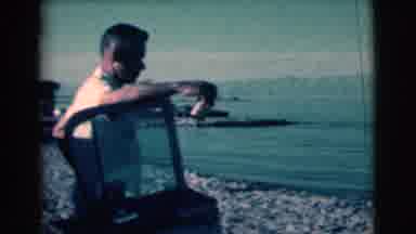Clarkdale Arizona (1961): A Man Having A Drink At The Beach