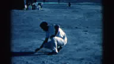 Clarkdale Arizona (1961): A Man Is Drawing Something In The Dirt With A Stick As