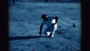 Clarkdale Arizona (1961): A Man Dressed In All White Meals Drawing In The Dirt
