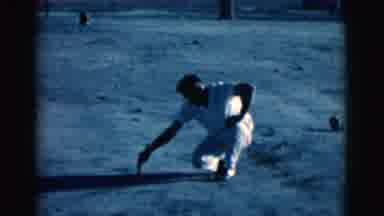 Clarkdale Arizona (1961): A Man Is Writing Words In The Sand As A Lady Stands And