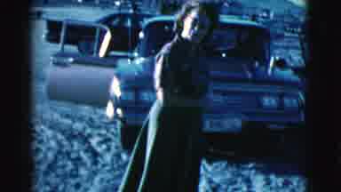 Clarkdale Arizona (1961): Woman Wearing Green Skirt Walks On Sand At Beach On A