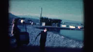 Clarkdale Arizona (1961): A Woman And Boys Standing Next To A Car On The Shore's