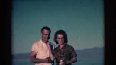 Clarkdale Arizona (1961): Man Wearing White Shirt Takes Gold Cup From Hand Of