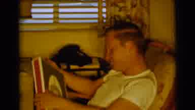 Clarkdale Arizona (1961): One Person Sitting In The Chair And Something In His