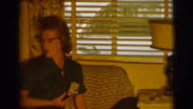 Clarkdale Arizona (1961): Older Mother Excitedly Holding Shiny Item Talking