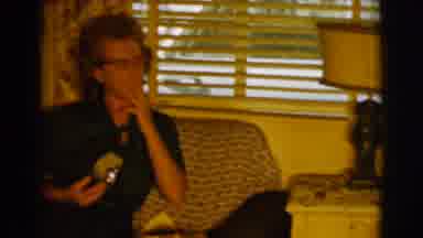 Clarkdale Arizona (1961): A Lady Is Sitting On Her Sofa Smoking A Cigarette As A