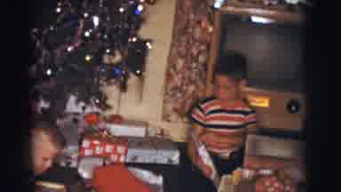 Clarkdale Arizona (1961): Two Young Boys Opening Presents Under The Tree On