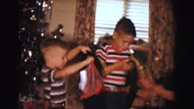 Clarkdale Arizona (1961): Two Boys Opening Up Christmas Presents On Christmas