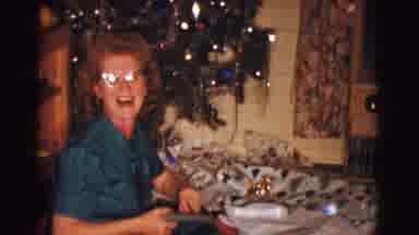 Clarkdale Arizona (1961): A Lady By Christmas Tree Opening Gifts