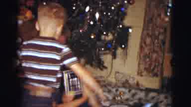 Clarkdale Arizona (1961): Middle Aged Woman Sitting On Floor Opening Present While