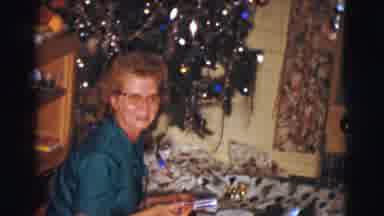 Clarkdale Arizona (1961): People Sitting Around Tree Unwrapping Gifts