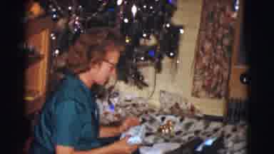 Clarkdale Arizona (1961): Happy Woman Sitting On A Floor In Front Of A Christmas