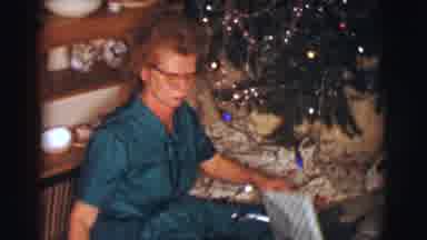 Clarkdale Arizona (1961): A Woman Sitting On The Floor Next To A Christmas Tree