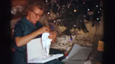 Clarkdale Arizona (1961): Woman Wearing Green Dress Sits Next To Christmas Tree