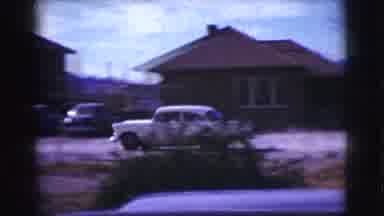 Clarkdale Arizona (1961): Man Enters Red Car As White Car Drives Past Him