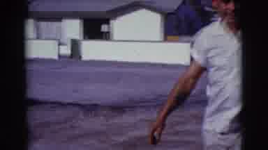 Clarkdale Arizona (1961): Man Wearing White Shirt Walks To Woman Sitting Black Car