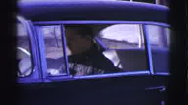 Clarkdale Arizona (1961): A Man Is Sitting In A Black Car Putting The Car In