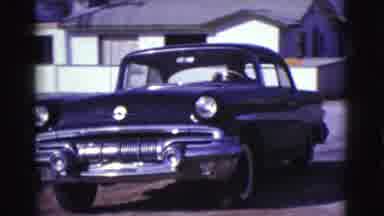 Clarkdale Arizona (1961): Black Car Backing Out Of A Driveway On To Street In