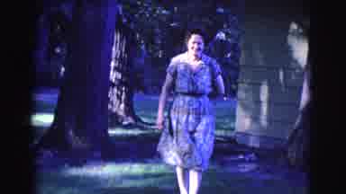Clarkdale Arizona (1961): Grandmother Approaching Grandchild Outside With A