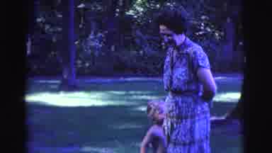 Clarkdale Arizona (1961): Happy Woman Slowly Walking With One Hand Behind Her Back